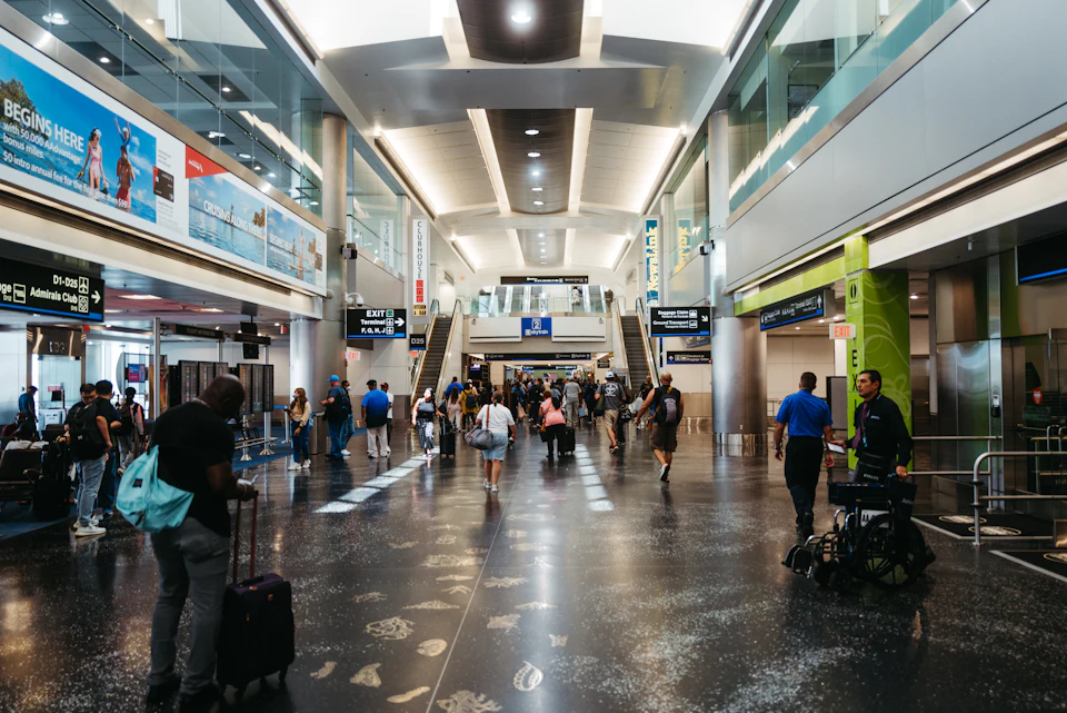 Airport departures hall with check-in signs, the first stage of the departure process at Marrakech Menara Airport.