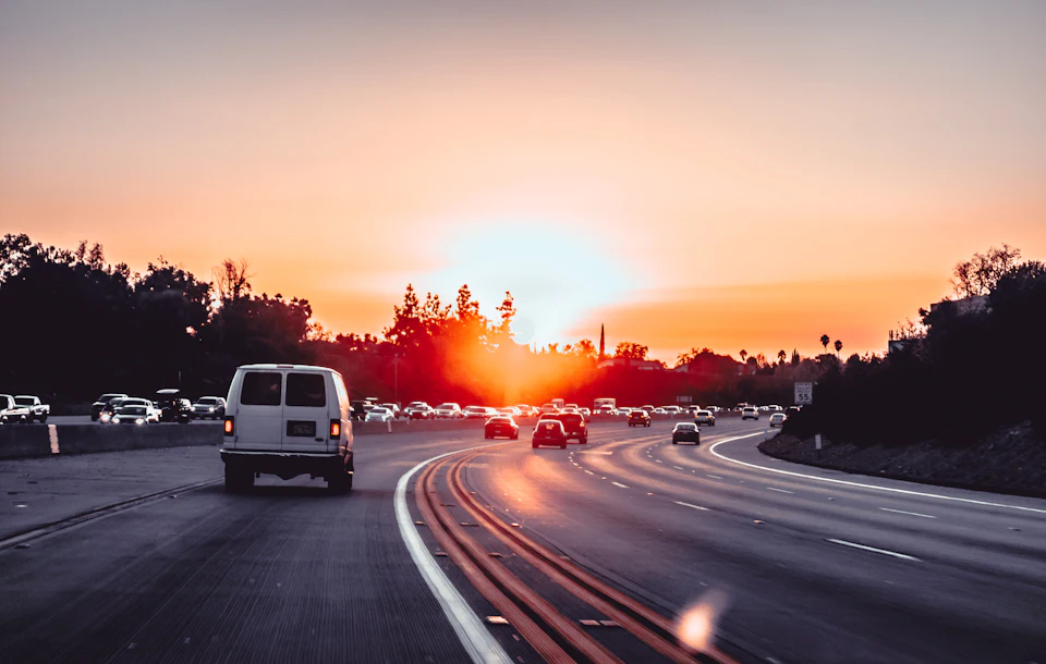 Motorway at sunset seen from a car, the kind of road that links Casablanca airport to Marrakech