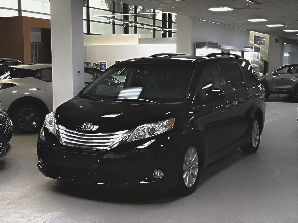 Black minivan used for family and group transfers