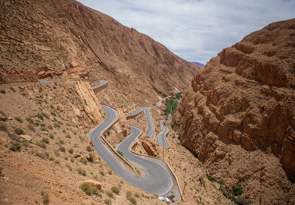 Hairpin bends of a mountain road in the High Atlas, typical of the climb to the Tizi n'Tichka pass between Marrakech and Ouarzazate